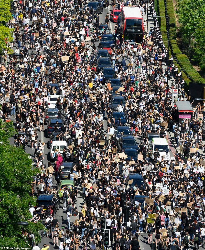 Police arrest five after assault on officers as thousands of Black Lives Matter activists marched on US embassy in London